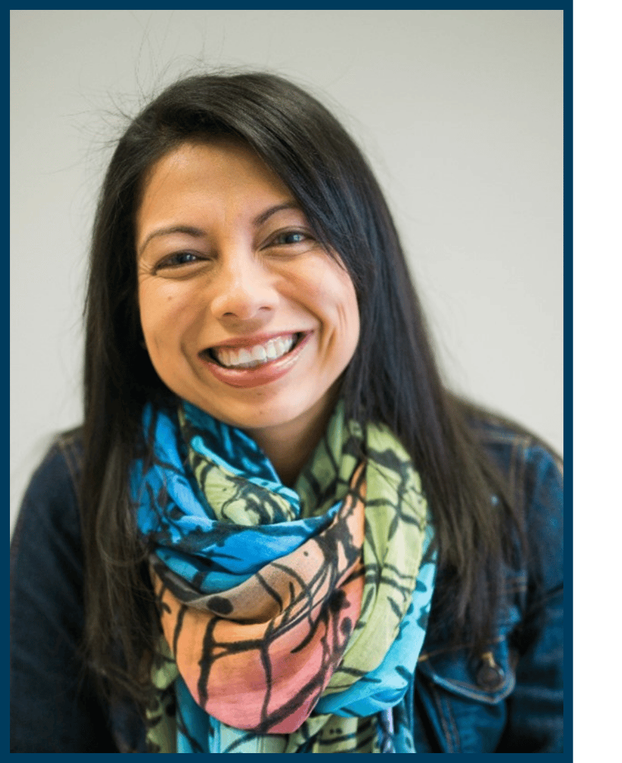 Framed headshot of Dr. Rebeca Chow. A smiling woman with straight dark hair wearing a navy blue shirt and colorful scarf.
